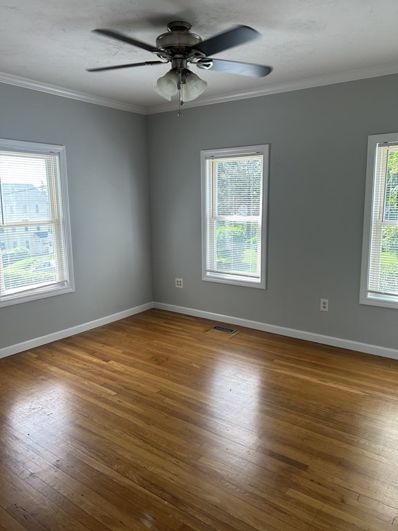 46 Tatman Street Worcester, MA 01607 - Photo 8 of 31 a view of an empty room with wooden floor and a window