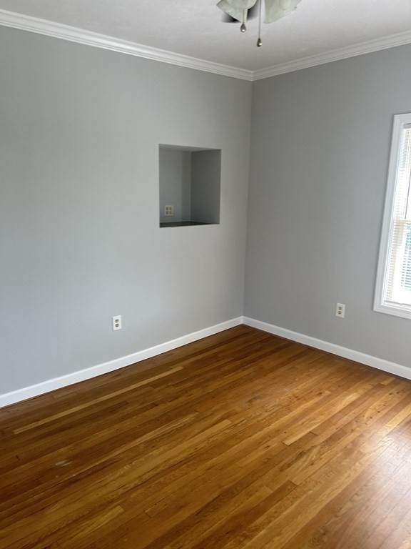 46 Tatman Street Worcester, MA 01607 - Photo 9 of 31 a view of an empty room with window and wooden floor