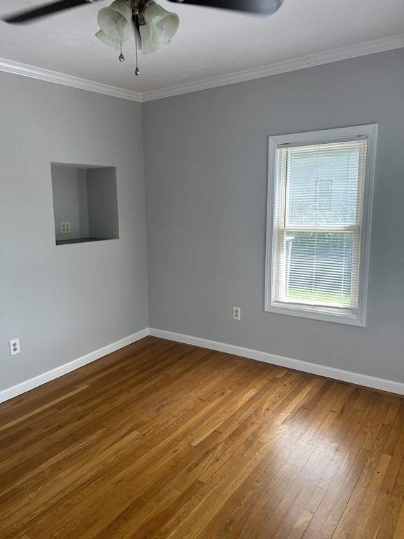 46 Tatman Street Worcester, MA 01607 - Photo 10 of 31 a view of an empty room with wooden floor and a window