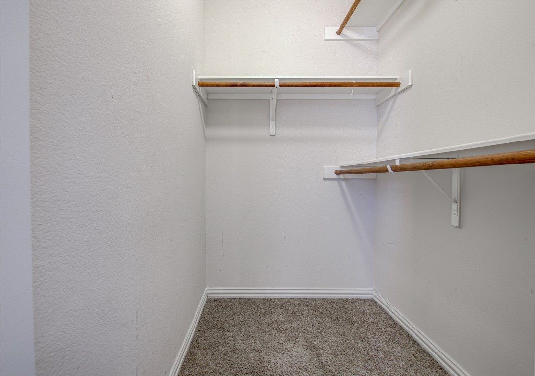239 Pond View Pass Buda, TX 78610 - Photo 14 of 30 Walk in closet featuring carpet
