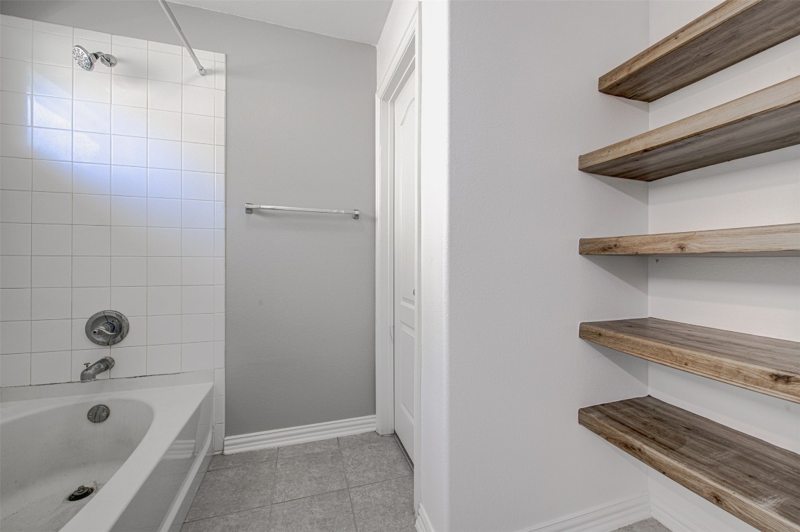 239 Pond View Pass Buda, TX 78610 - Photo 23 of 30 Full bath featuring shower / bath combination and light tile patterned floors