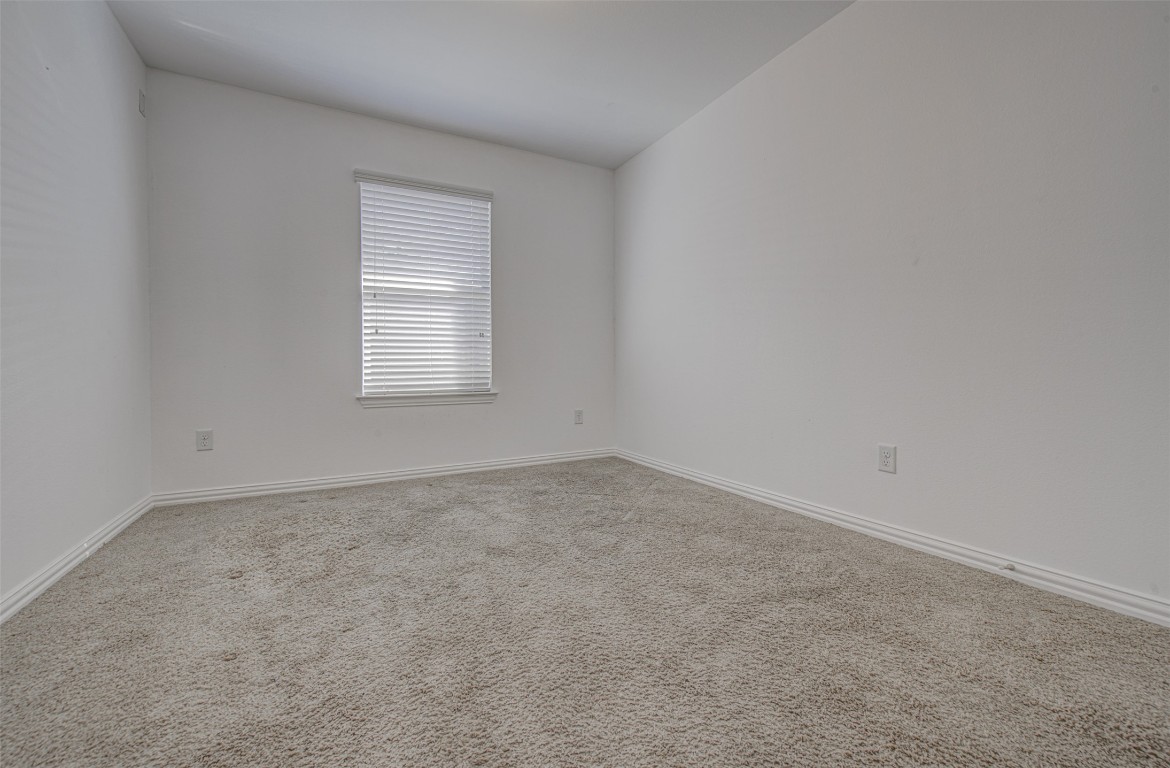 239 Pond View Pass Buda, TX 78610 - Photo 8 of 30 Unfurnished room with carpet and baseboards