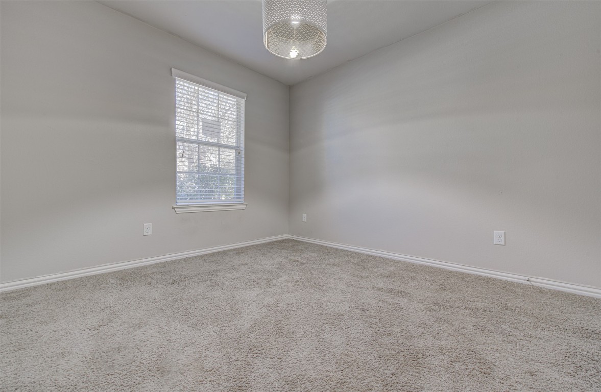 239 Pond View Pass Buda, TX 78610 - Photo 9 of 30 Unfurnished room with carpet flooring and baseboards