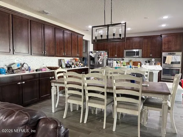 a view of a dining room with furniture