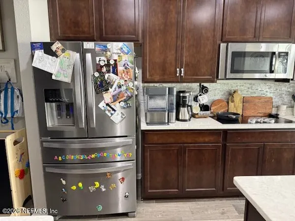 a kitchen with a stove and a microwave