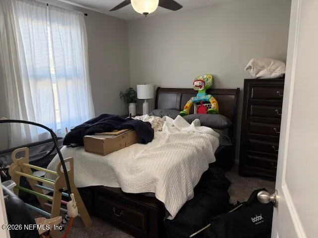 a white toilet sitting next to a sink