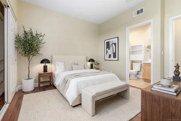 a view of an empty room and wooden floor