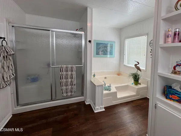 a bathroom with a bathtub and a shower
