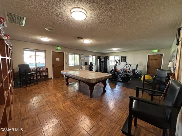 a living room with furniture a rug and a window