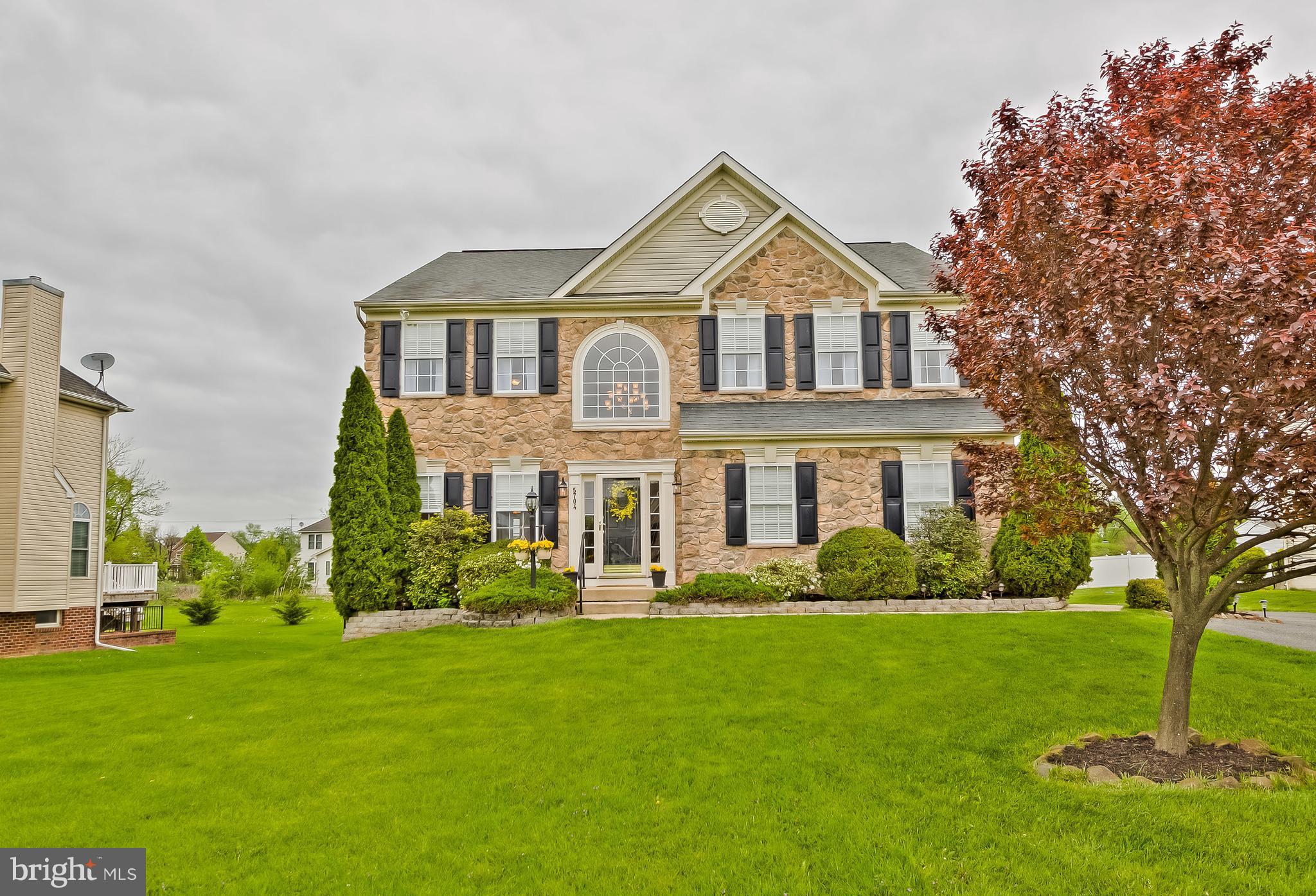 5704 New Forge Road White Marsh, MD 21162 - Photo 1 of 30 a front view of a house with a yard