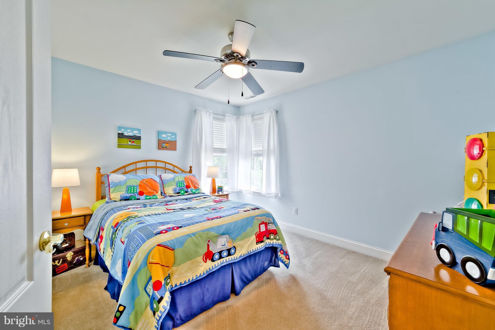 5704 New Forge Road White Marsh, MD 21162 - Photo 16 of 30 a bedroom with bed and window