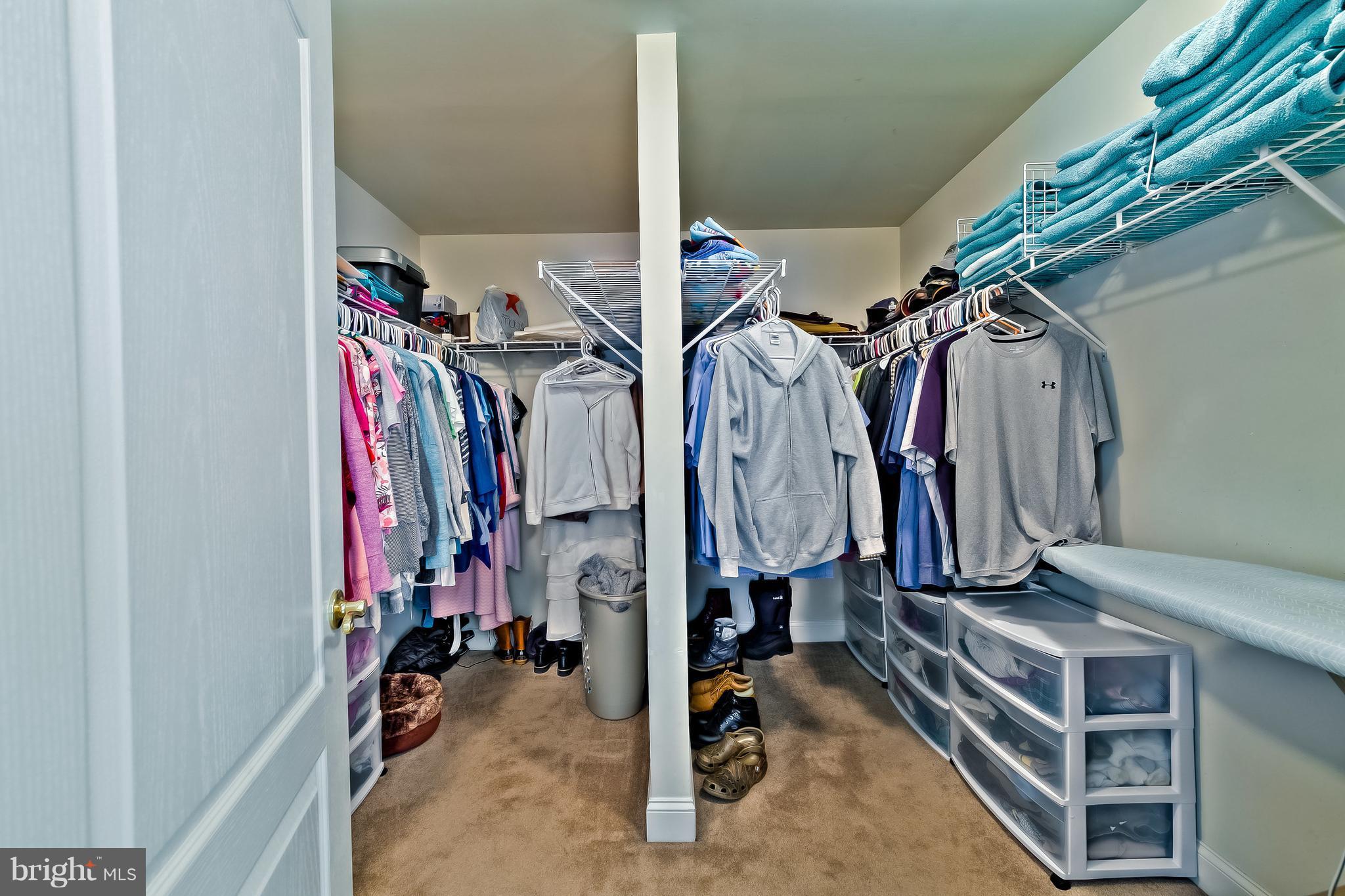 5704 New Forge Road White Marsh, MD 21162 - Photo 24 of 30 a view of walk in closet with clothes