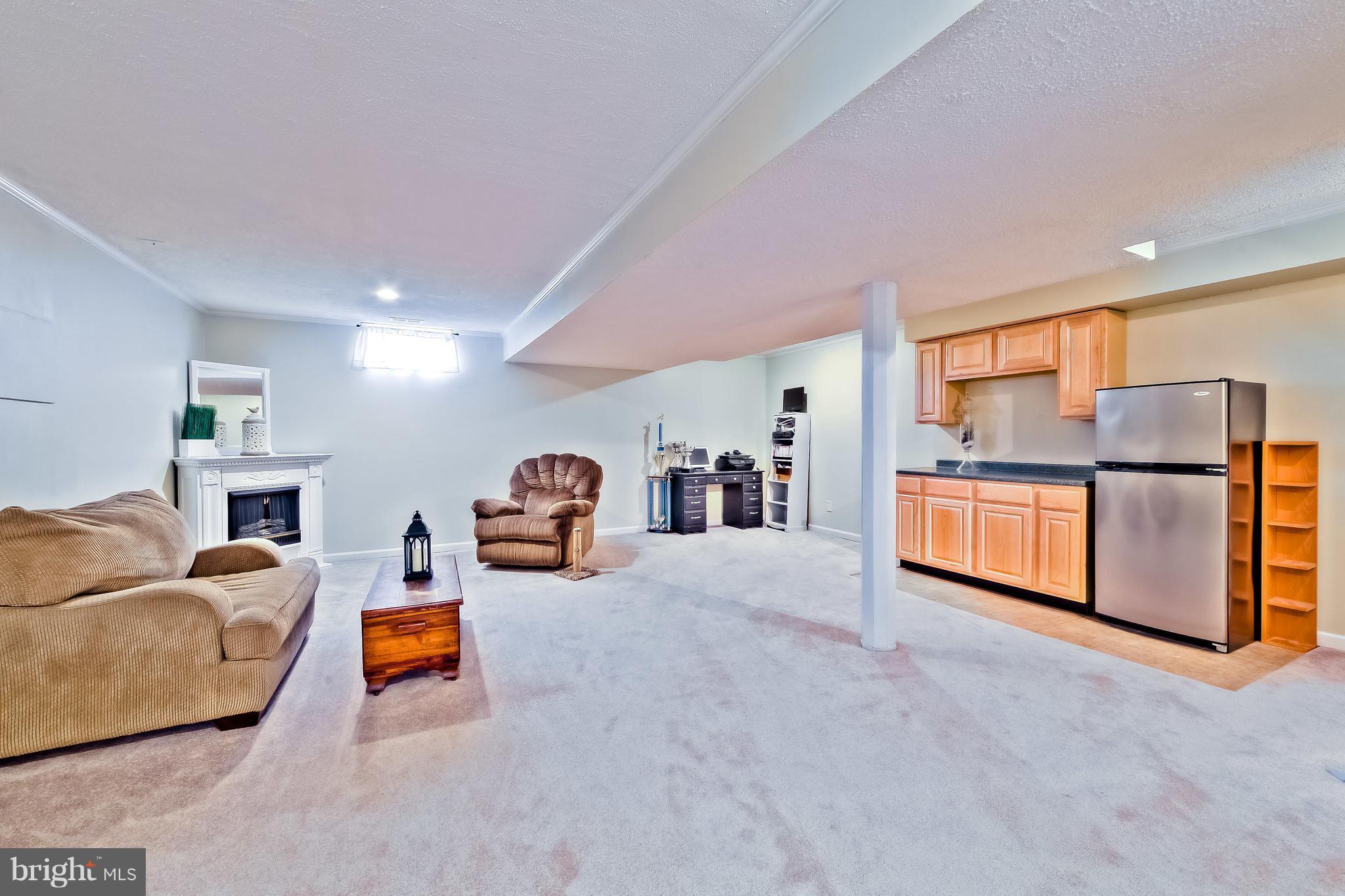 5704 New Forge Road White Marsh, MD 21162 - Photo 25 of 30 a living room with furniture and a flat screen tv