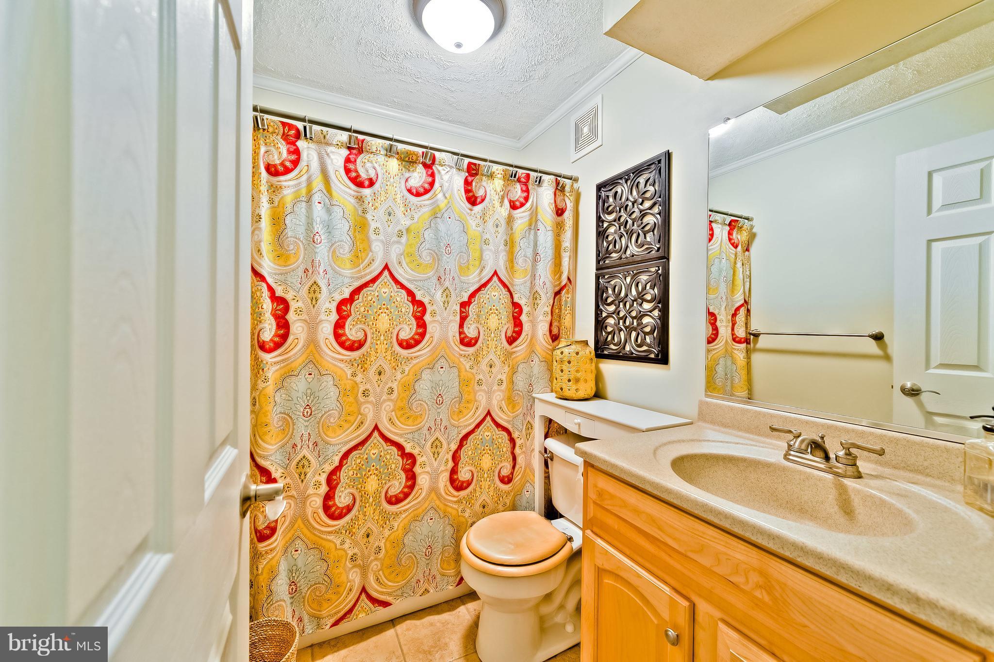 5704 New Forge Road White Marsh, MD 21162 - Photo 27 of 30 a bathroom with a sink and a mirror
