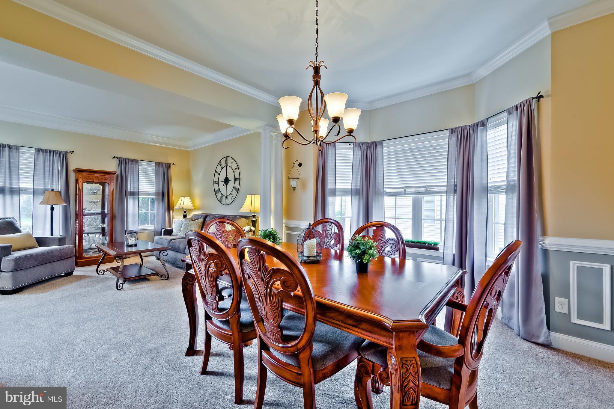 5704 New Forge Road White Marsh, MD 21162 - Photo 5 of 30 a dining room with furniture a chandelier and window