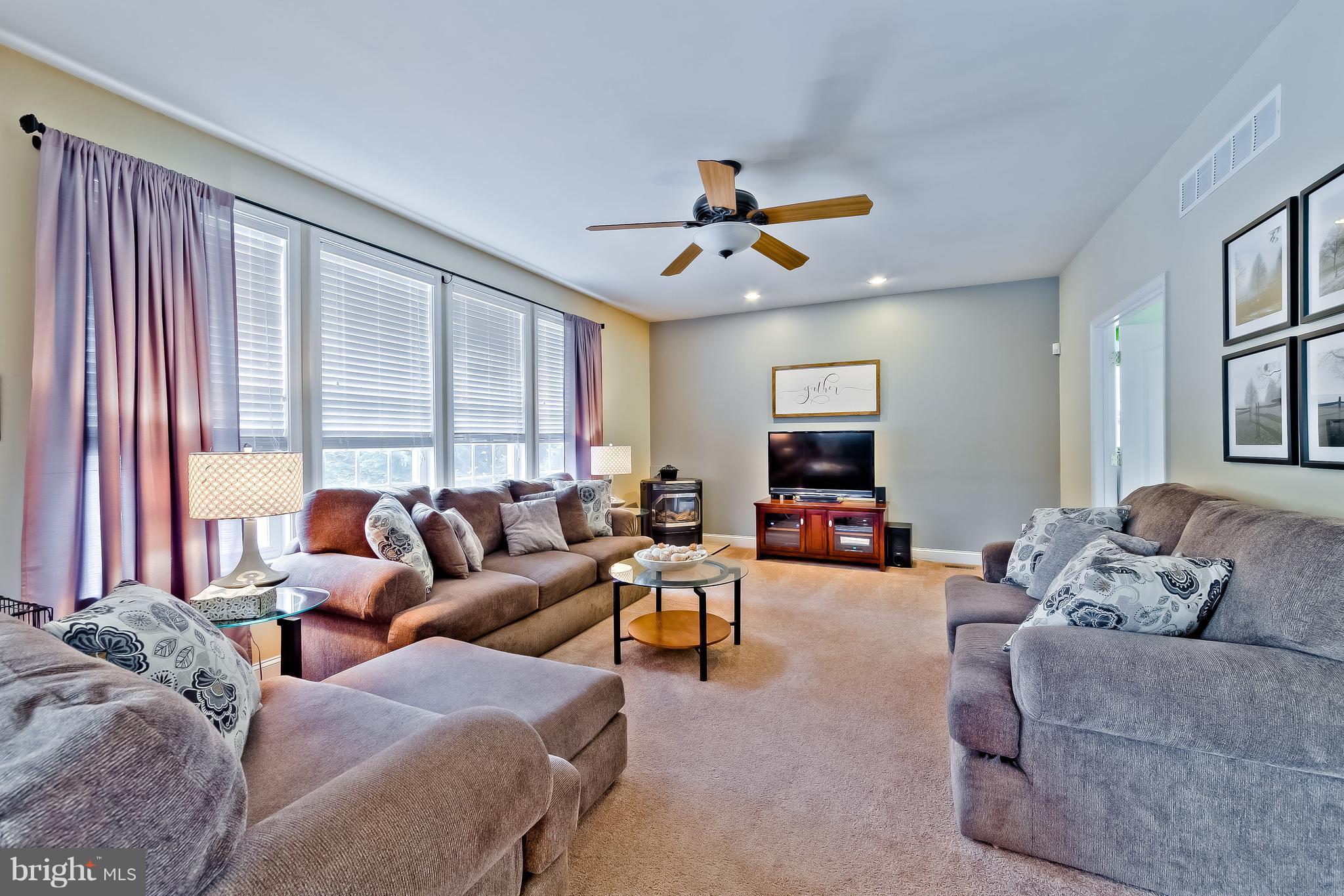 5704 New Forge Road White Marsh, MD 21162 - Photo 6 of 30 a living room with furniture and a flat screen tv