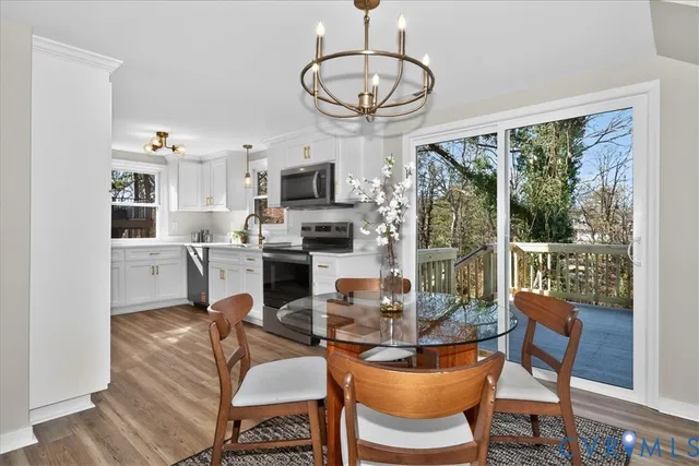 a living room with fireplace furniture and a floor to ceiling window