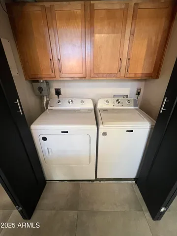 a kitchen with stainless steel appliances granite countertop a refrigerator a stove and a sink