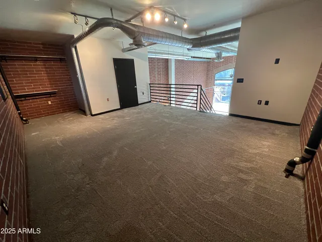 a bathroom with a shower and toilet