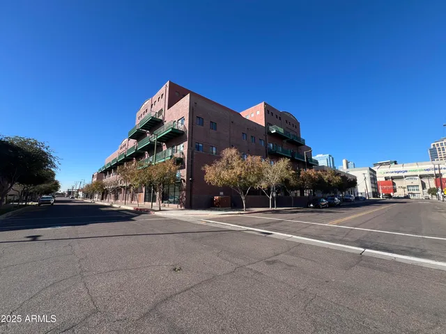 a view of a street with a building in the background