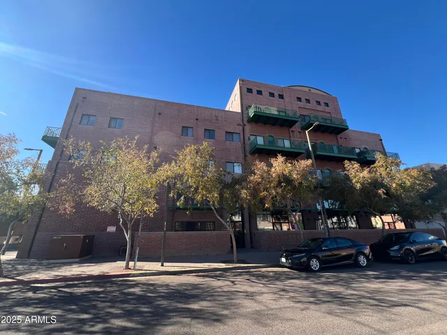 a view of a building and car parked
