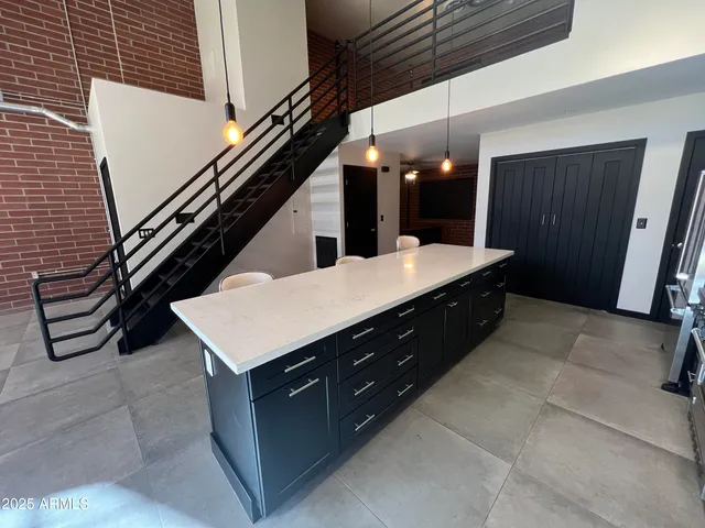 a kitchen with a sink a counter space and appliances