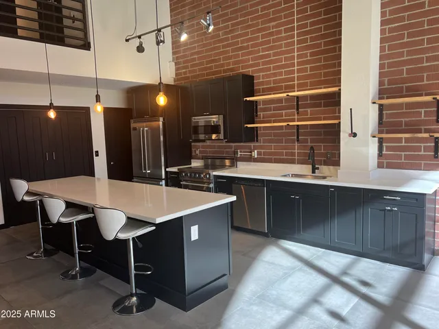 a close view of stove and microwave