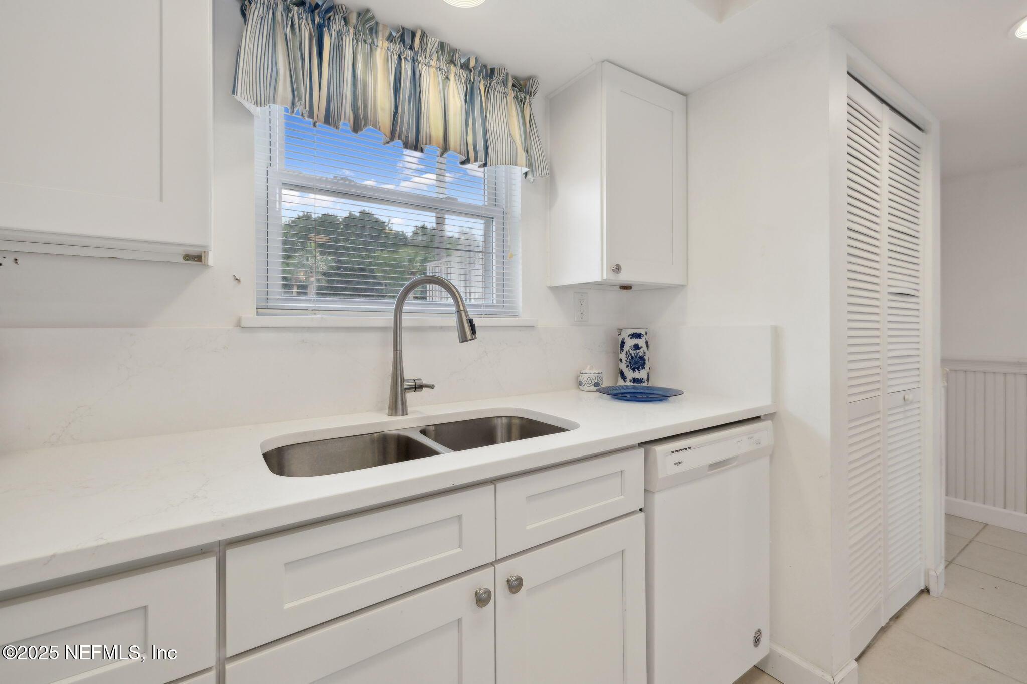 125 River Bend Road, Unit BLD D Welaka, FL 32193 - Photo 12 of 62 a kitchen with a sink and cabinets
