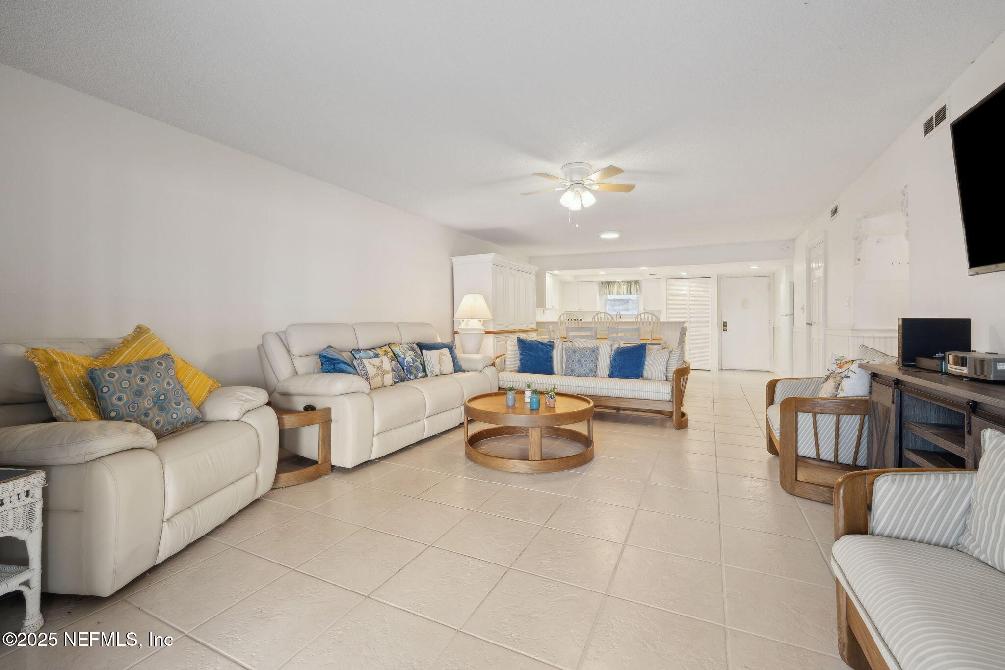 125 River Bend Road, Unit BLD D Welaka, FL 32193 - Photo 17 of 53 a living room with furniture and a flat screen tv