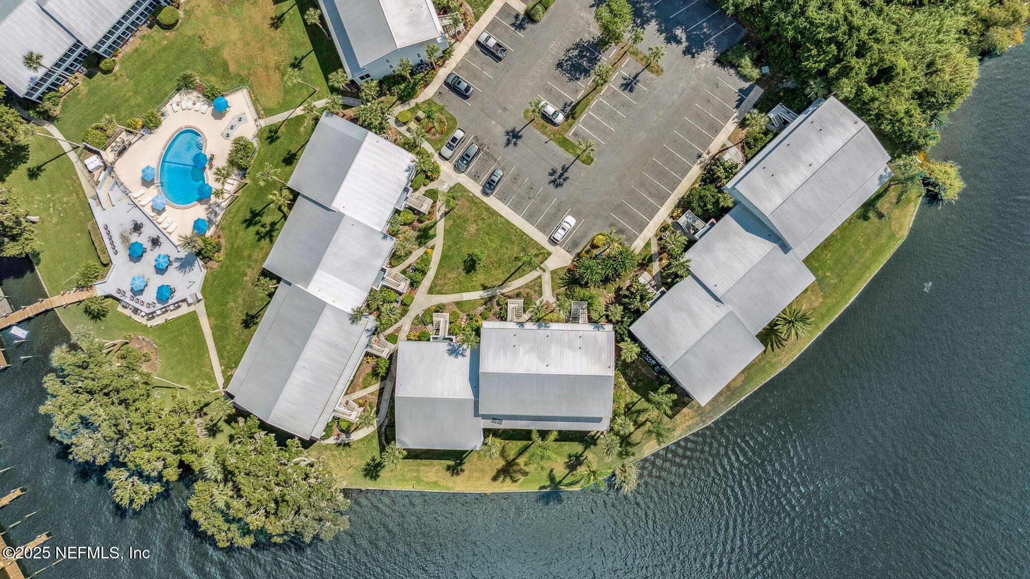 125 River Bend Road, Unit BLD D Welaka, FL 32193 - Photo 50 of 53 an aerial view of a house with a yard and garden