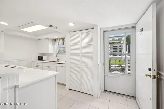 a kitchen with a stove a refrigerator and a sink