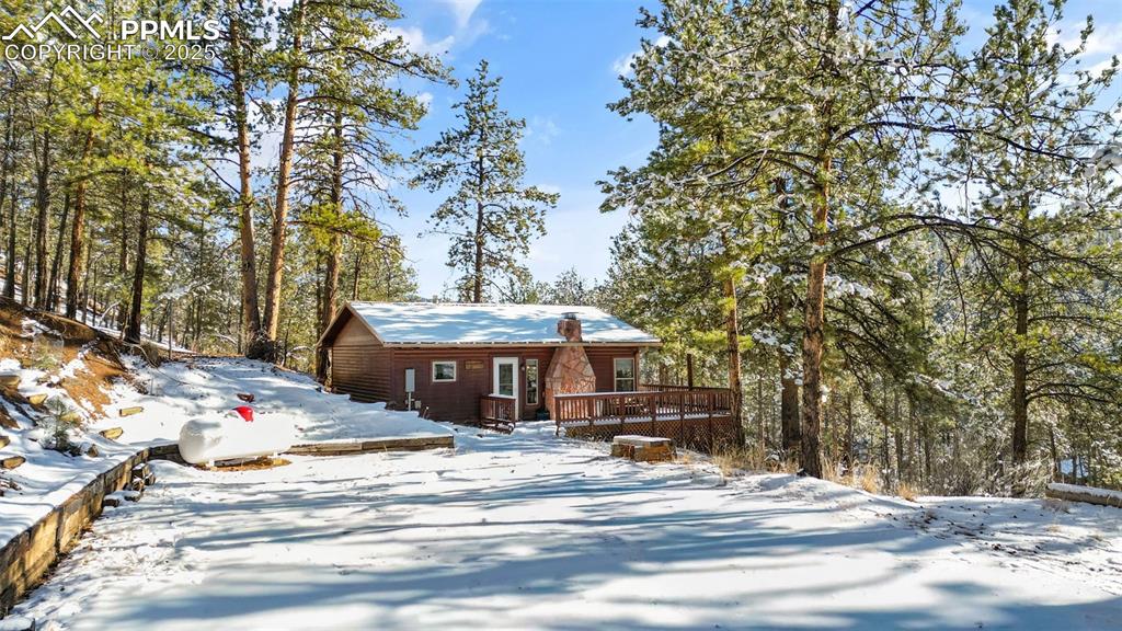 15103 Rainbow Road Sedalia, CO 80135 - Photo 1 of 48 a front view of a house with a yard