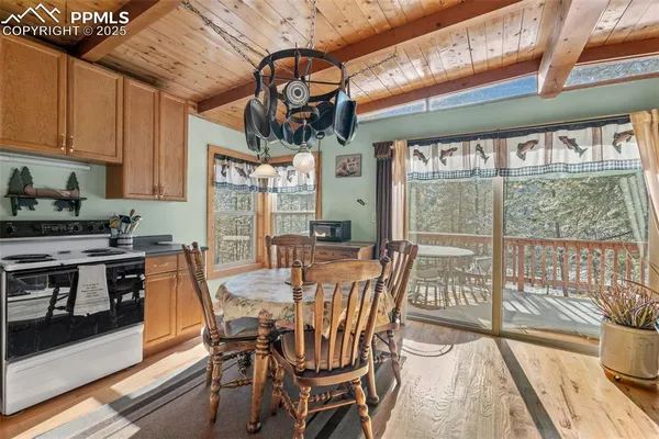 a view of a dining room with furniture window and outside view