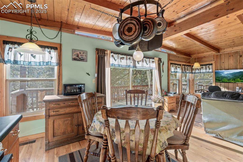15103 Rainbow Road Sedalia, CO 80135 - Photo 14 of 48 a view of a dining room with furniture window and outside view