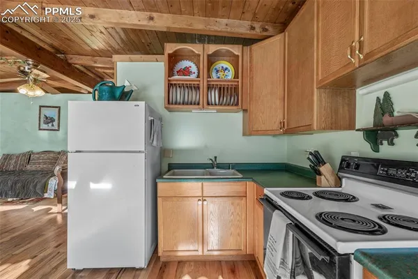 a kitchen with a stove and a refrigerator