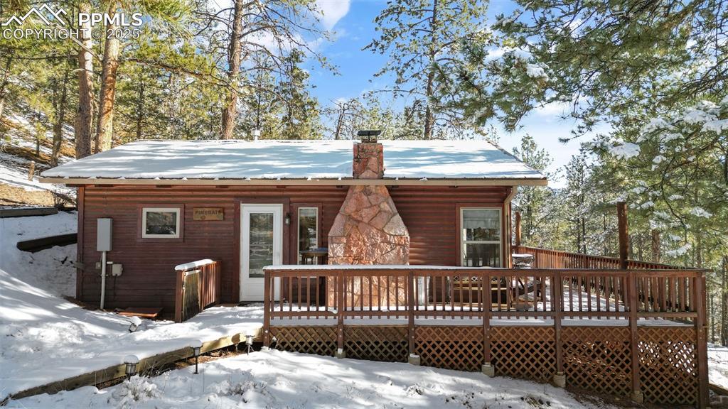 15103 Rainbow Road Sedalia, CO 80135 - Photo 2 of 48 a view of a house with a small yard and wooden fence