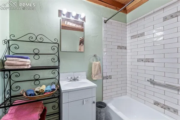 a bathroom with a sink and a shower curtain