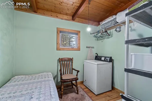 a bedroom with a bed and a table