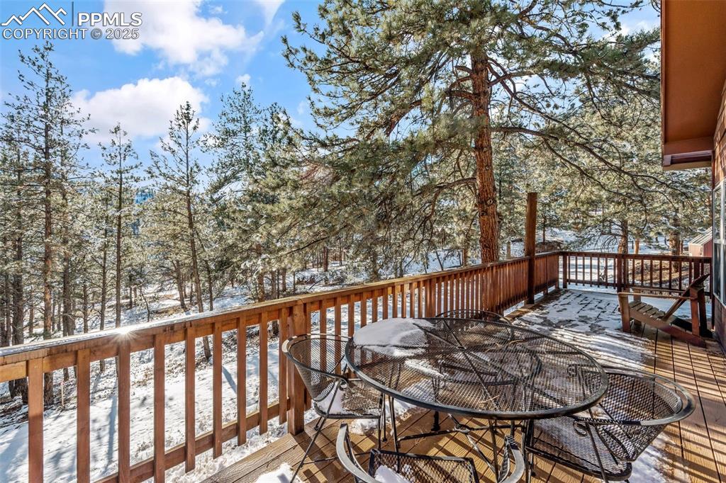 15103 Rainbow Road Sedalia, CO 80135 - Photo 26 of 48 a view of balcony with wooden floor and fence