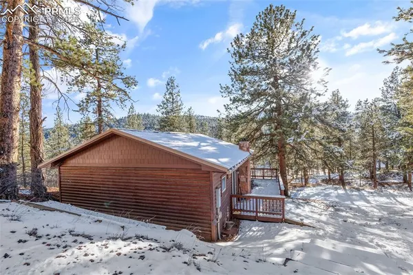 a view of a house with a snow in the yard