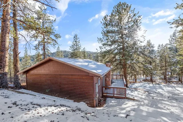 a view of a house with a snow in the yard