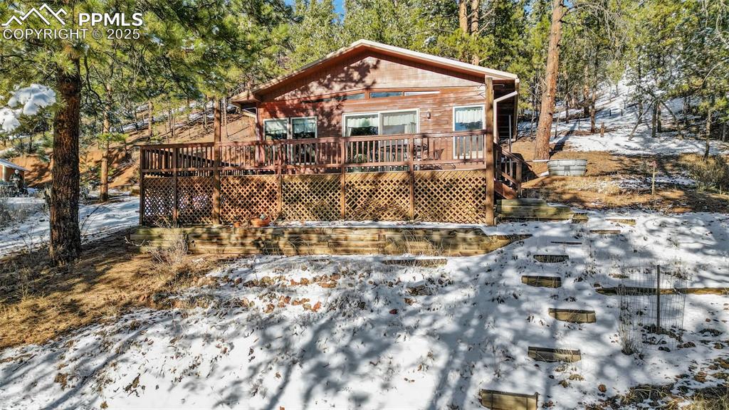 15103 Rainbow Road Sedalia, CO 80135 - Photo 30 of 48 a view of a house with a yard