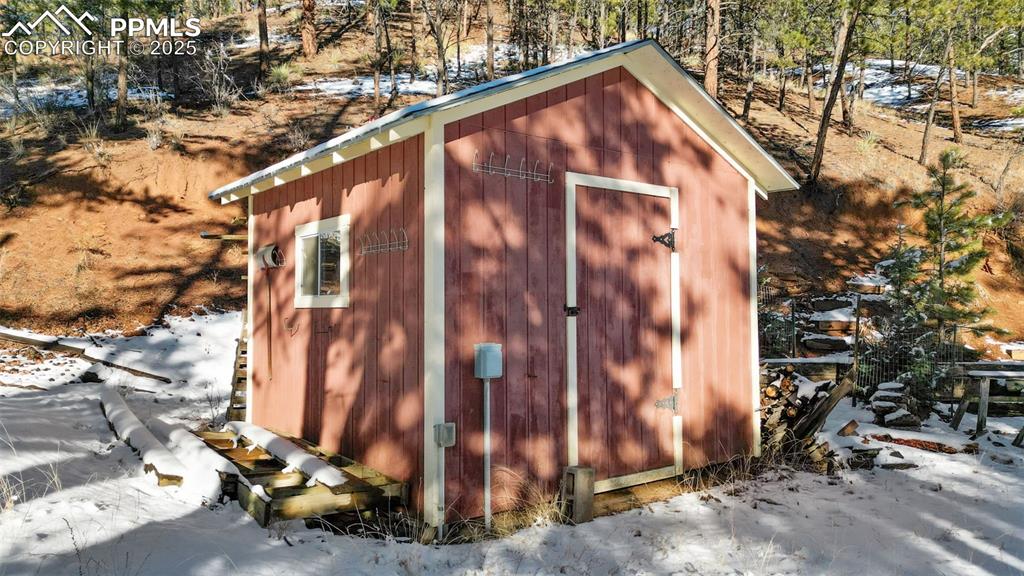 15103 Rainbow Road Sedalia, CO 80135 - Photo 32 of 48 a view of a house with a tree