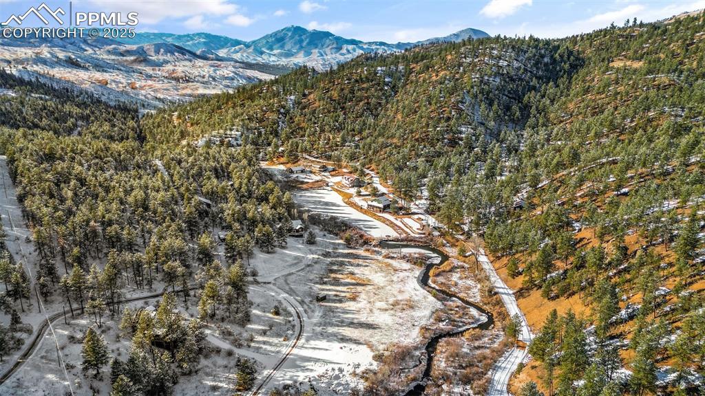 15103 Rainbow Road Sedalia, CO 80135 - Photo 41 of 48 a view of a city with mountain view