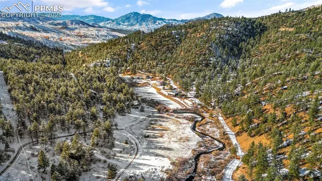 a view of mountain view with mountains in the background