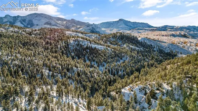 a view of mountain view with mountains in the background