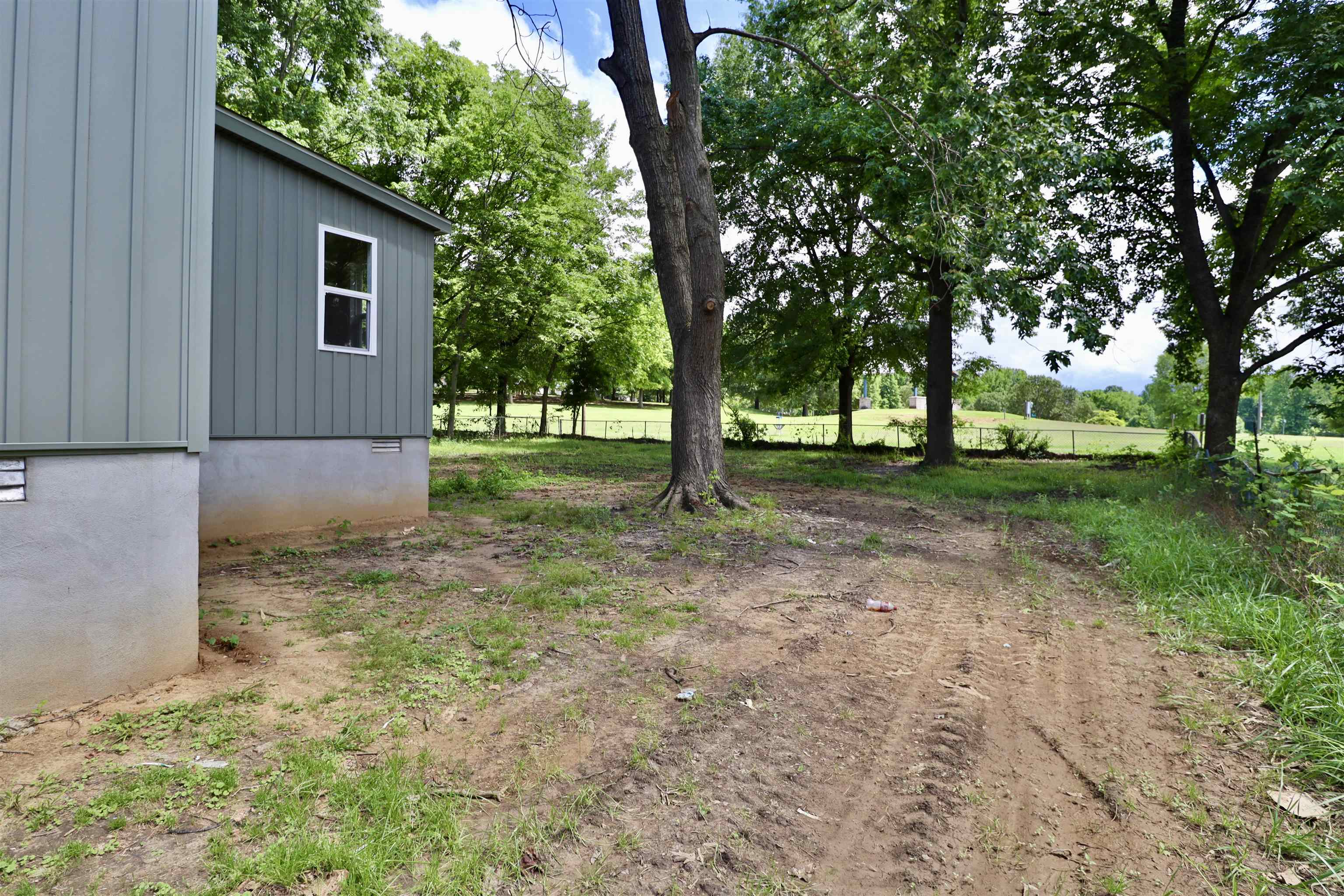 224 Kellar Avenue Ripley, TN 38063 - Photo 25 of 30 a view of a backyard with large trees