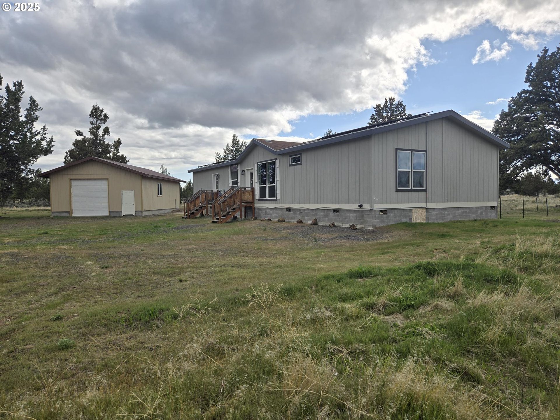 9290 Southwest 3115th Road Culver, OR 97734 - Photo 17 of 21 a view of a house with a yard
