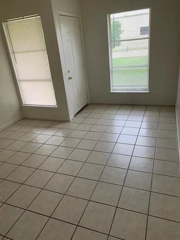 a view of an empty room and window