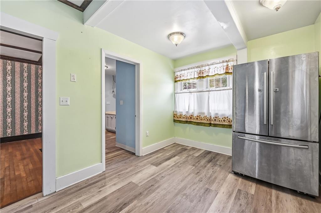 300 Ormond Avenue Sharon, PA 16146 - Photo 19 of 45 a kitchen with granite countertop wooden floors and stainless steel appliances